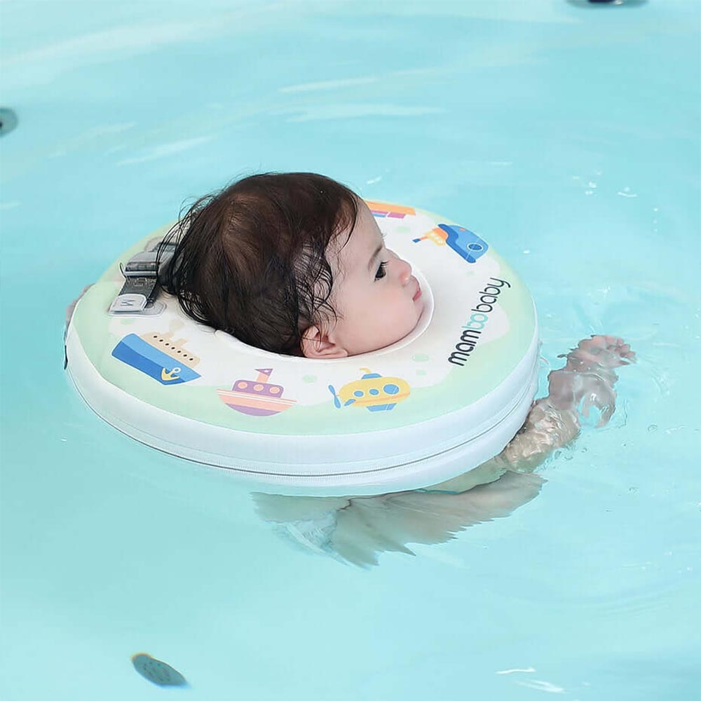 Relaxed infant resting comfortably in the Mambobaby™ Boats Neck Float during bath time.